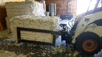 Baling and stacking of securely shredded paper documents